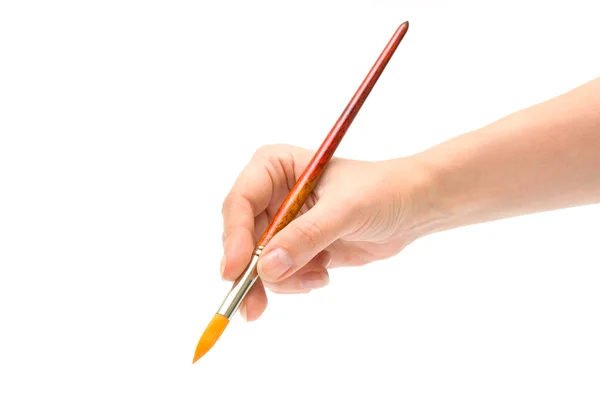Handen, håller en pensel — Stockfoto