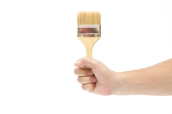 Hand holding brush isolated on white background — Stock Photo, Image