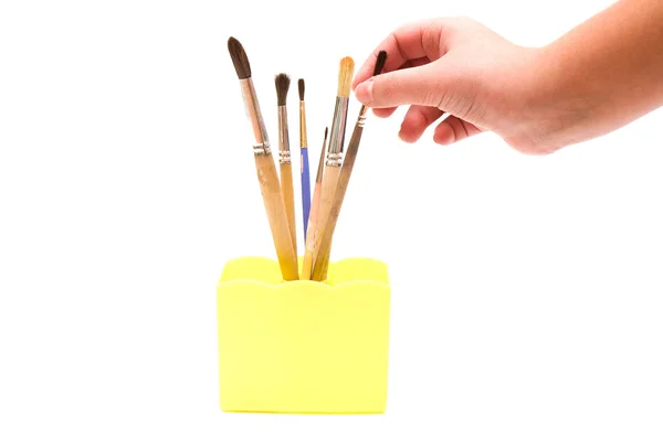 Hand and paintbrushes — Stock Photo, Image