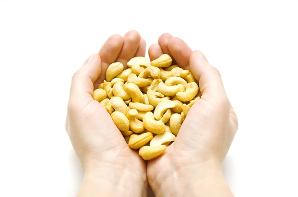 Cashews on a palms on white background — Stock Photo, Image