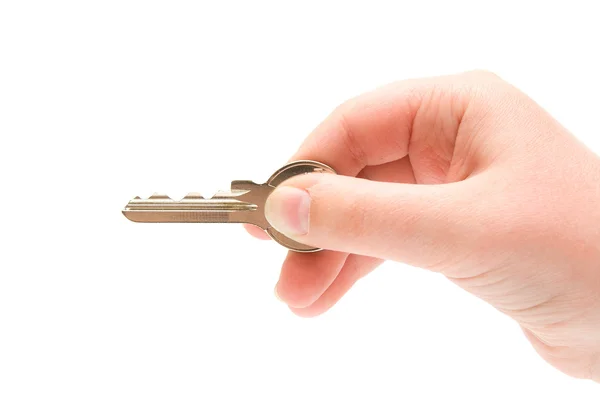 Ruka držící stříbrný klíč — Stock fotografie