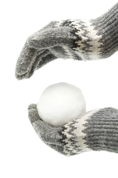 Hands in gloves holding snowball — Stock Photo, Image