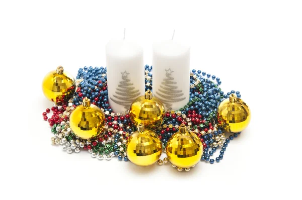 Yellow spheres,tinsel and candles on white background — Stock Photo, Image