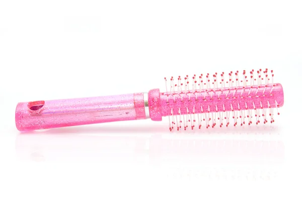 Pink comb on white background — Stock Photo, Image