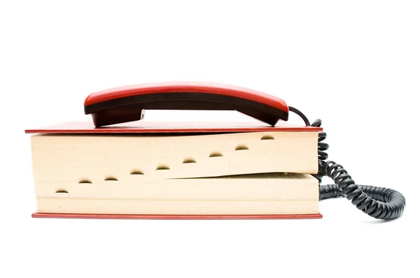 电话筒与白色背景上的字典 — 图库照片