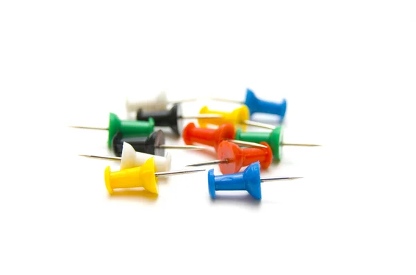 Several pushpins on isolated — Stock Photo, Image