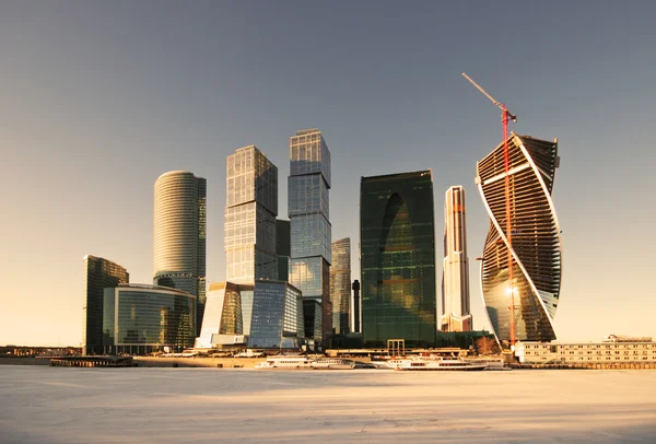 Modern skyscrapers and frozen river — Stock Photo, Image