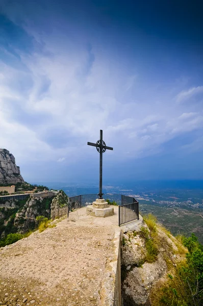 Cross on the cliff Montserrat mountain — Stock Photo, Image