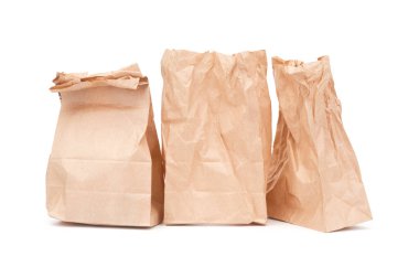 Three wrinkled paper packets isolated on white background