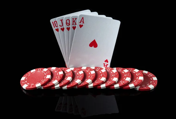 Poker cards with royal flush combination. Close-up of playing cards and chips in poker club. Free advertising space