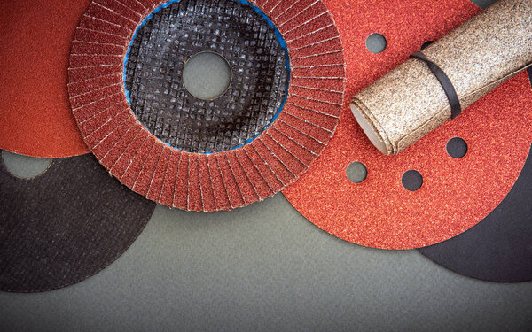 Set of abrasive tools and sandpaper used for cleaning or grinding products. Industrial tools.