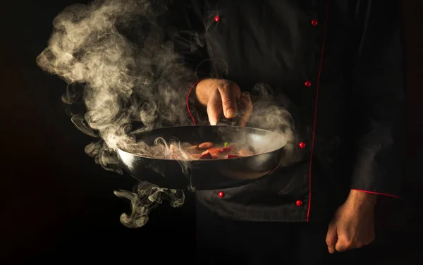 Molecular gastronomy or cuisine. Chef cooking vegetables in a frying pan. Menu for restaurant or hotel with advertising space.