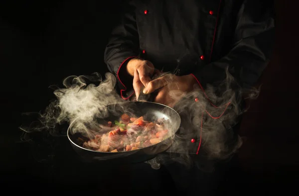 Molecular gastronomy or cuisine. Cook cooking vegetables in a hot pan. Menu for restaurant or hotel with advertising space.