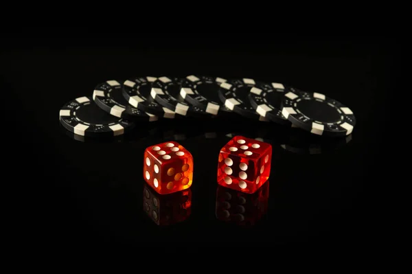 Craps is a dice game in which players bet on the outcomes of a pair of dice. Black chips received as a result of winning.