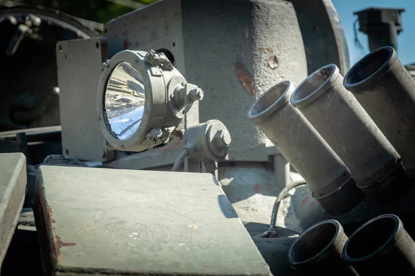 Protection elements of a military tank and a lantern for lighting
