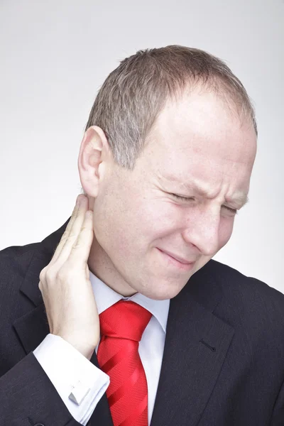 Businessman with neck pain — Stock Photo, Image