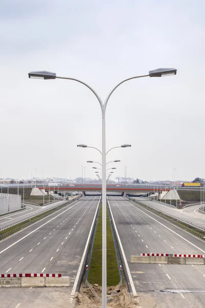 Highway under construction. Road partly ready. — Stock Photo, Image