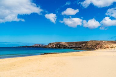Sandy beach called Playa del Pozo and volcanic rocks in Los Ajaches National Park on Lanzarote, Canary Islands, Spain