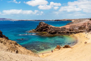 White sand and volcanic rocks at Papagayo Beach located on south end of Lanzarote, Canary Islands, Spain