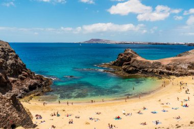 White sand and volcanic rocks at Papagayo Beach located on south end of Lanzarote, Canary Islands, Spain