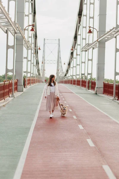 Stylish Woman Long Skirt White Jacket Smiling Bridge Dog Happy — Stok Foto