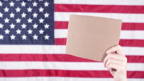 Young Woman Holds Empty Cardboard Space Text Sign American Flag — Stock videók