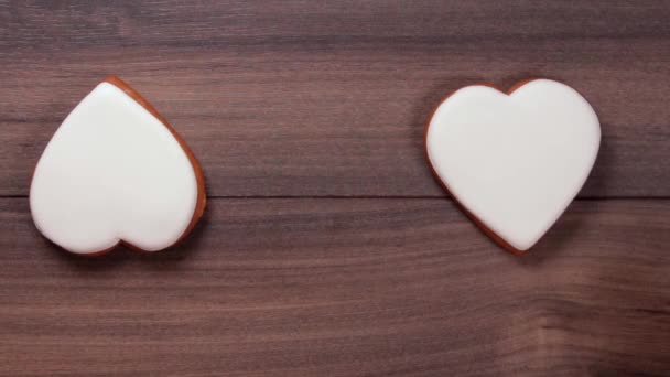 Female Hands Moving Each Other White Big Heart Cookies One — Stok video
