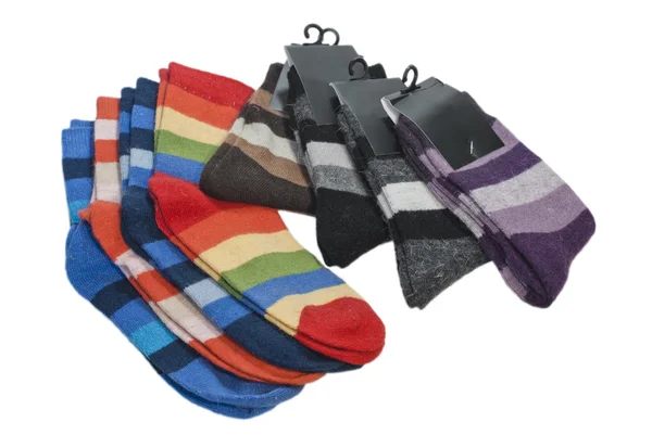 Varios pares de calcetines a rayas sobre un fondo blanco — Foto de Stock