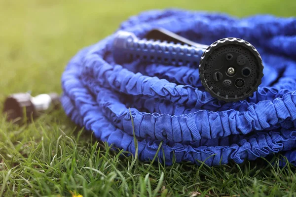 Close Watering Hose Lies Grassy Ground Blue Rubber Tube Device — Stock Fotó