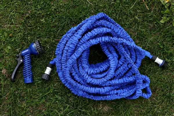 Close Watering Hose Lies Grassy Ground Blue Rubber Tube Device — стоковое фото