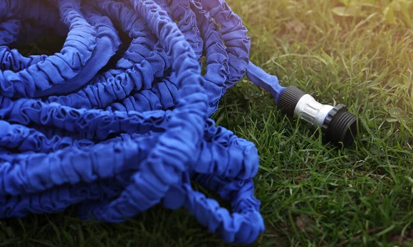 Close Watering Hose Lies Grassy Ground Blue Rubber Tube Device — Stock Fotó