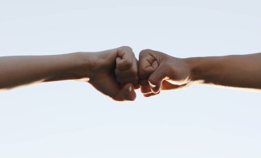 social distance. teamwork. fist to fist commit a respect and brotherhood gesture. business team hands fists. partnership friendship teamwork solidarity social distance.