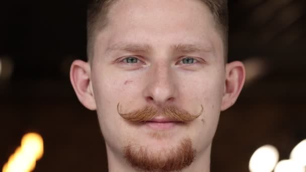 Portrait Young Man Mustache Beard Blinking Looking Camera Dark Light — Vídeos de Stock