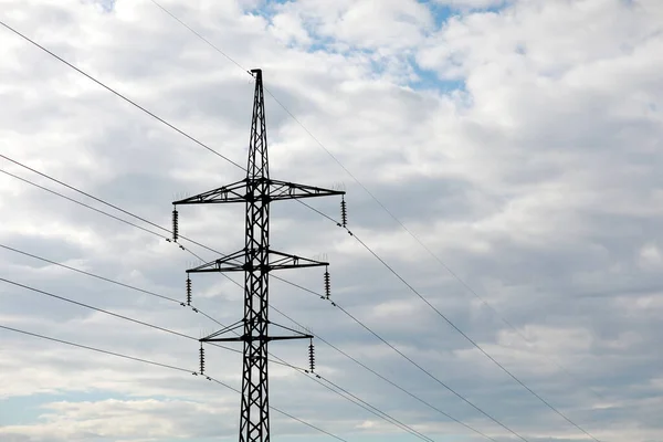 high-voltage power lines on blue sky background. electricity distribution station. Electrical net of poles on a panorama. power tower