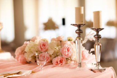 festive wedding table decoration candlesticks and candles. wedding day. High quality photo.