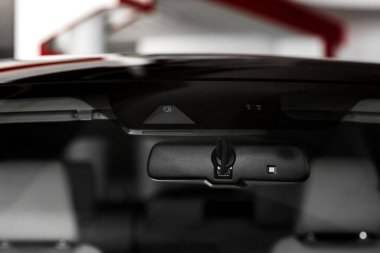 front Car CCTV camera video recorder, dash cam, for driving safety on the road. back view. Concept of safety camera for car protection, technology for safety.