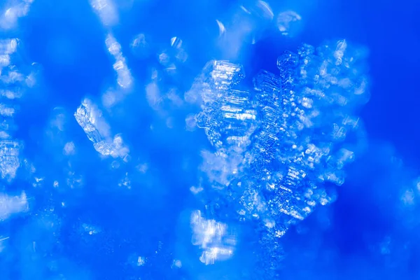 Close Snow Crystals Illuminated Blue Sunlight Winter Background Macro Real — Stock Photo, Image