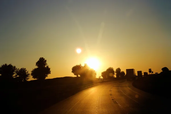 stock image sunset over the road in the city