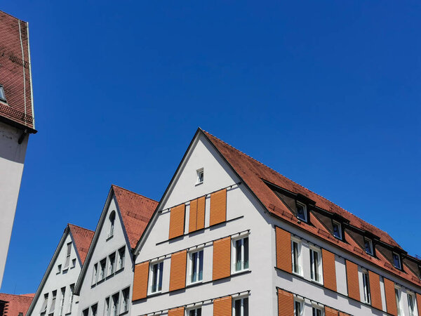 Beautiful residential buildings in Germany, Tubingen. Bright brown-white houses and blue sky, vintage atmosphere, vintage.