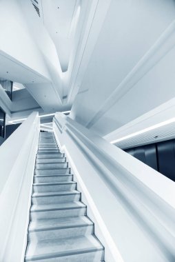 Interior view of empty futuristic stairway. Building abstract background
