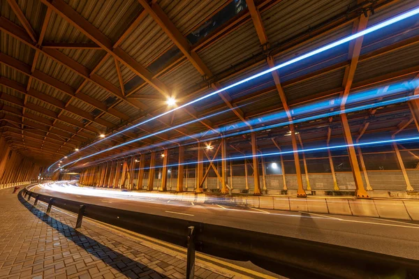 light trails and head lights of traffic in tunnel. Transportation background
