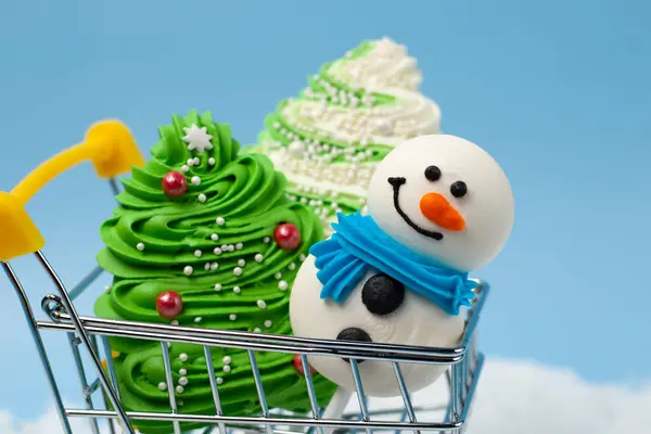 Sweet Christmas Trees Snowmen Sticks Shopping Cart Blue Background Confectionery — Stock Photo, Image
