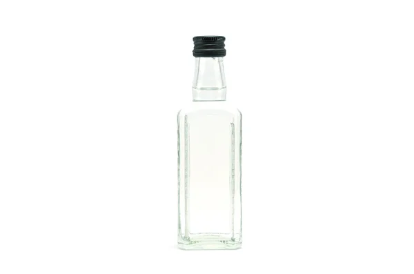 Una bottiglia di vetro riempita di liquido — Foto Stock