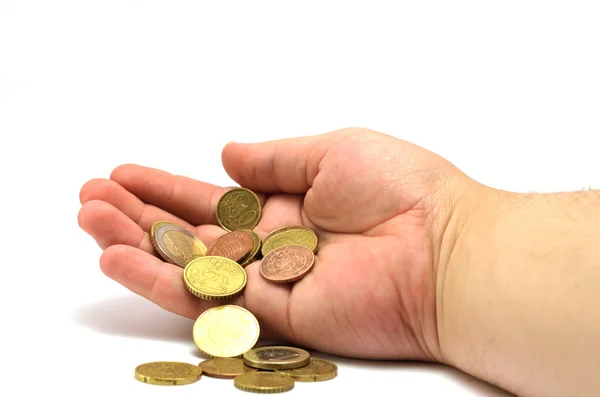 Hand with a fistful of coins — Stock Photo, Image