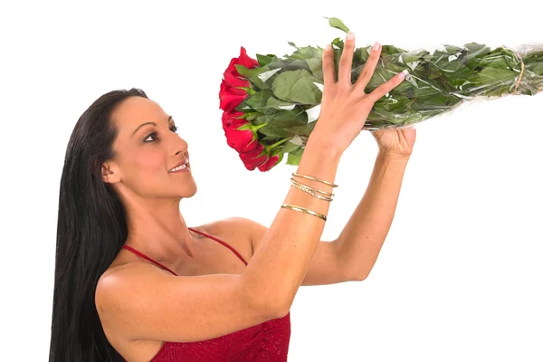 Red valentine dress holding up roses — Stock Photo, Image