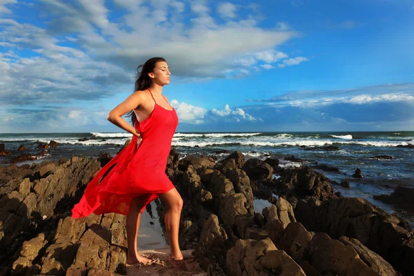 Brunette soaking up the sun on the beach — Stock Photo, Image