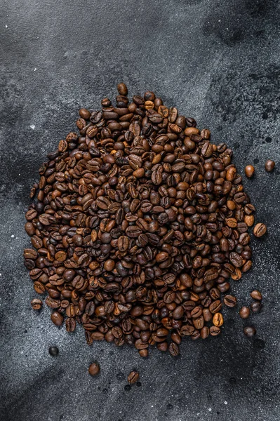 Roasted coffee beans on rustic table. Black background. Top view — Stock Photo, Image
