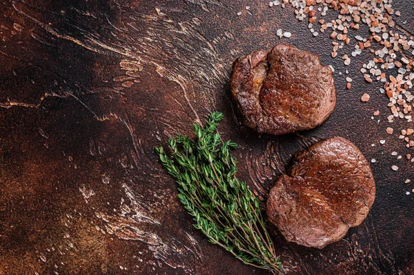 Grilled Fillet Mignon tenderloin meat beef steaks. Dark background. Top view. Copy space — Stock Photo, Image