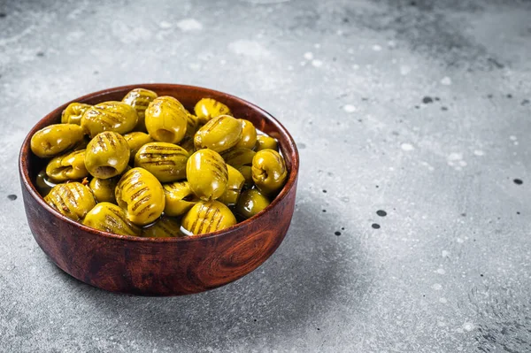 Grilled green organic olives. Gray background. Top view. Copy space — 스톡 사진