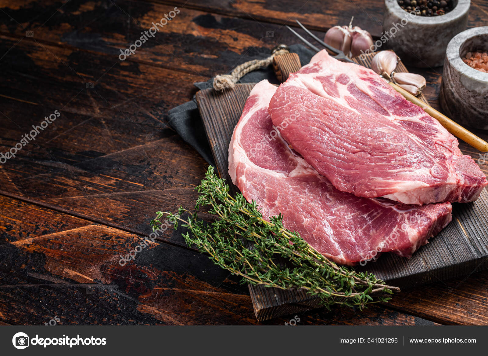 https://st.depositphotos.com/22628872/54102/i/1600/depositphotos_541021296-stock-photo-butcher-raw-pork-steak-from.jpg